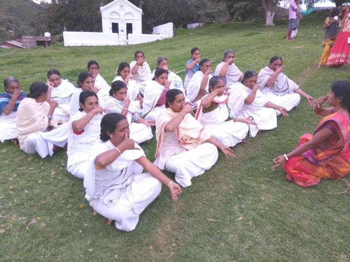 Kota women practising yoga